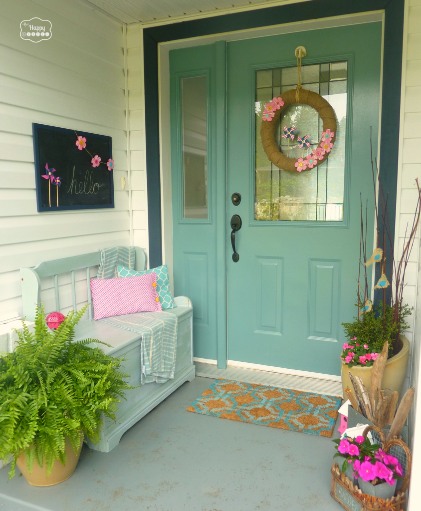 front porch with burlap pinwheel wreath and fern at thehappyhousie