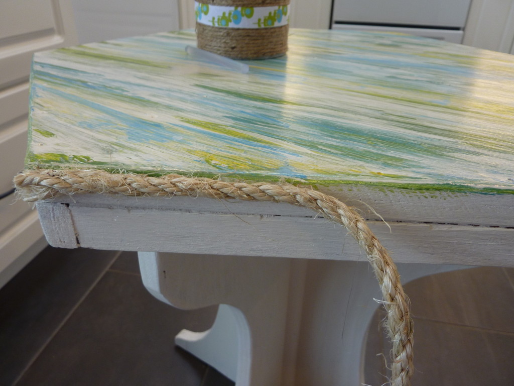 gluing and wrapping sisal rope around edges of texture table