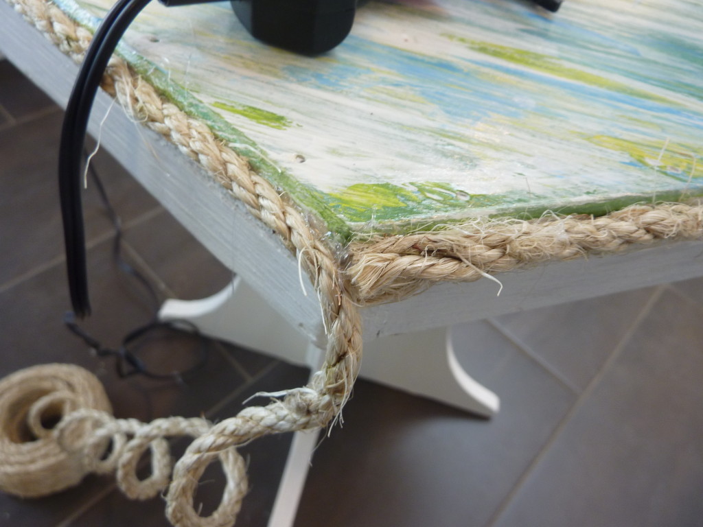 wrapping and gluing sisal rope around the edges of the texture table