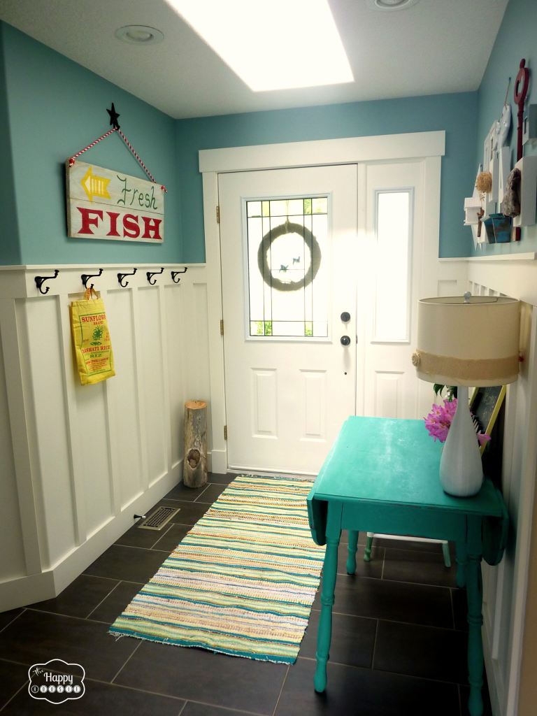 entry hall with board and batten and diy reclaimed wood sign at thehappyhousie
