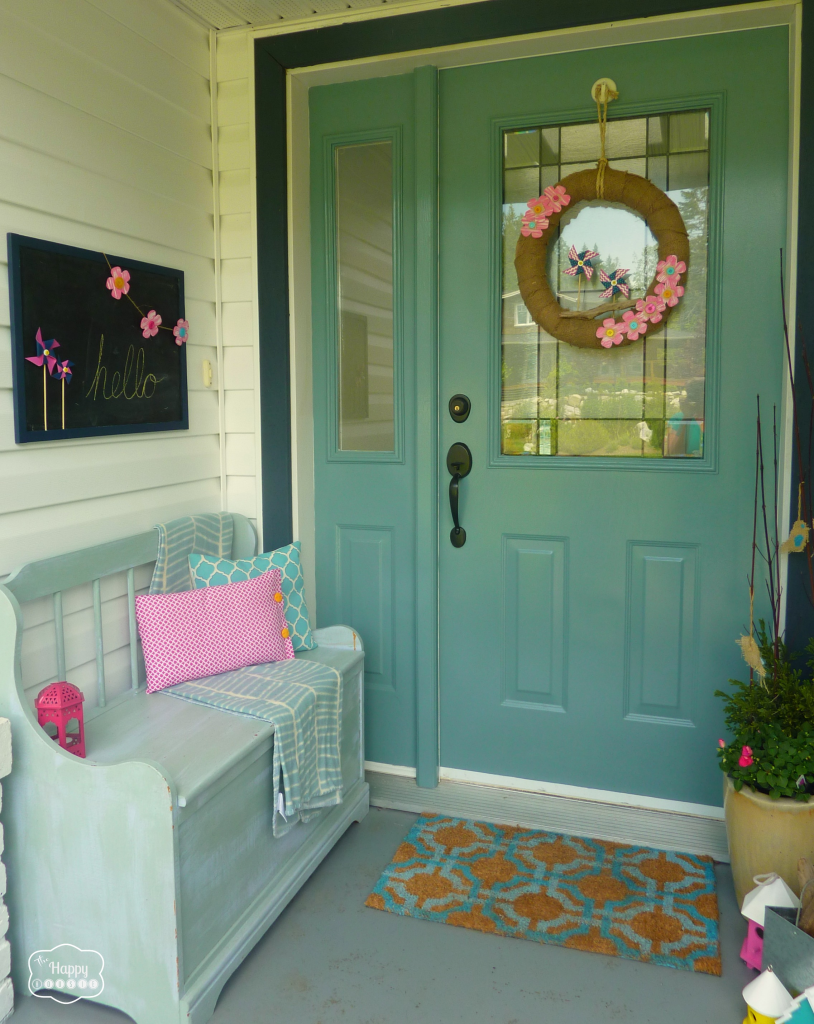 front porch with burlap pinwheel wreath at thehappyhousie