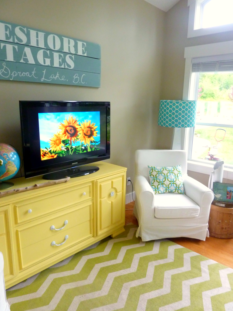 living room with diy chalk paint media console and diy reclaimed wood sign at thehappyhousie