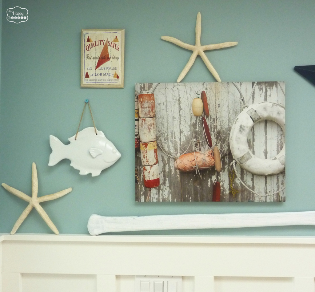 red white blue coastal entry gallery wall closeup at thehappyhousie