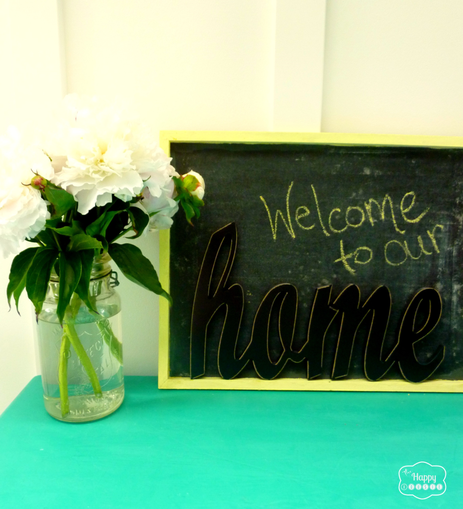 welcome chalkboard in entry hall with board and batten at thehappyhousie
