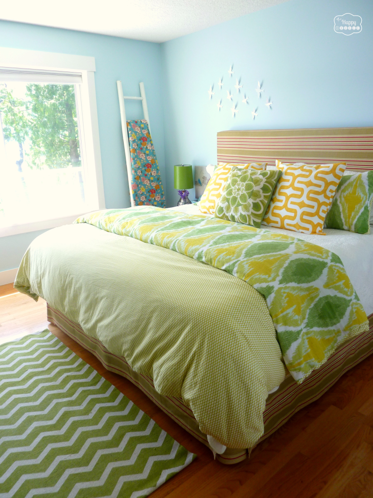 master bedroom for summer bed with mixed pattern bedding upholstered headboard at thehappyhousie