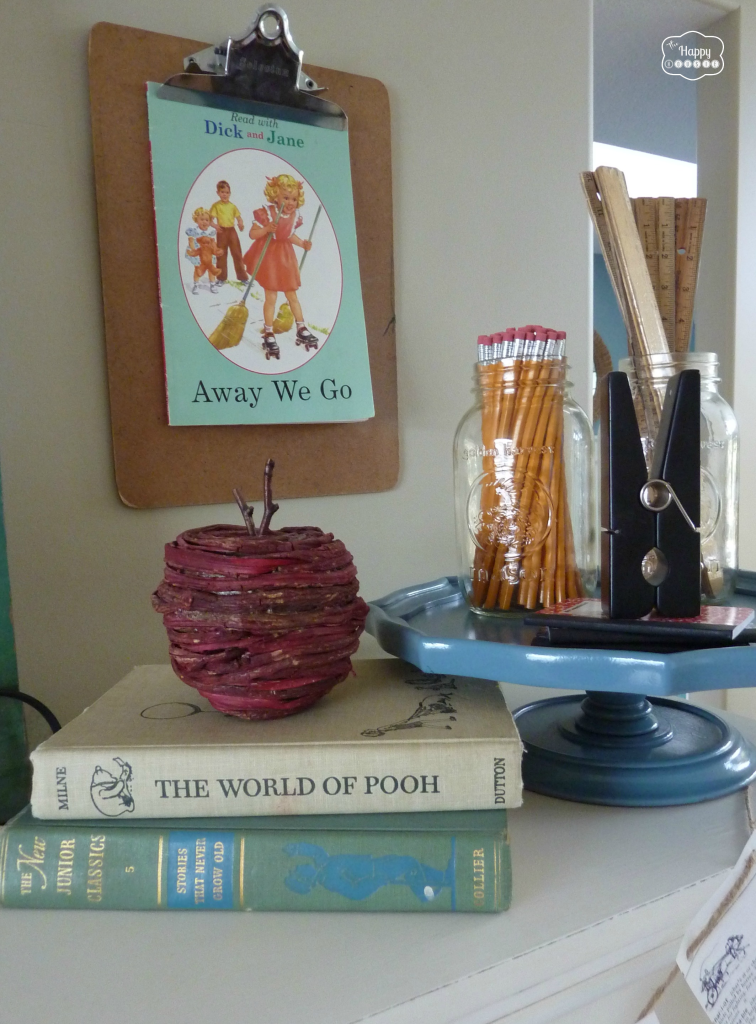 back to school mantel with pencils and rulers in mason jars, vintage books, clipboards on wall at thehappyhousie