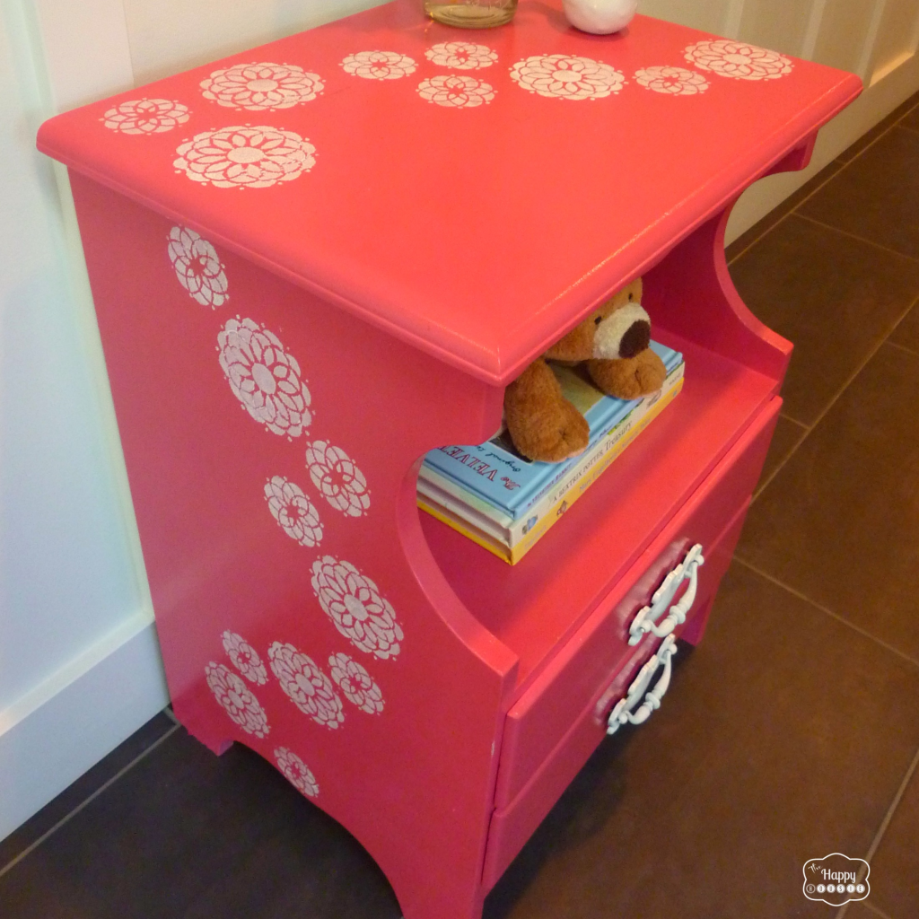 coral pink nightstand with sweeping stenciled flowers angled thumbnail at thehappyhousie