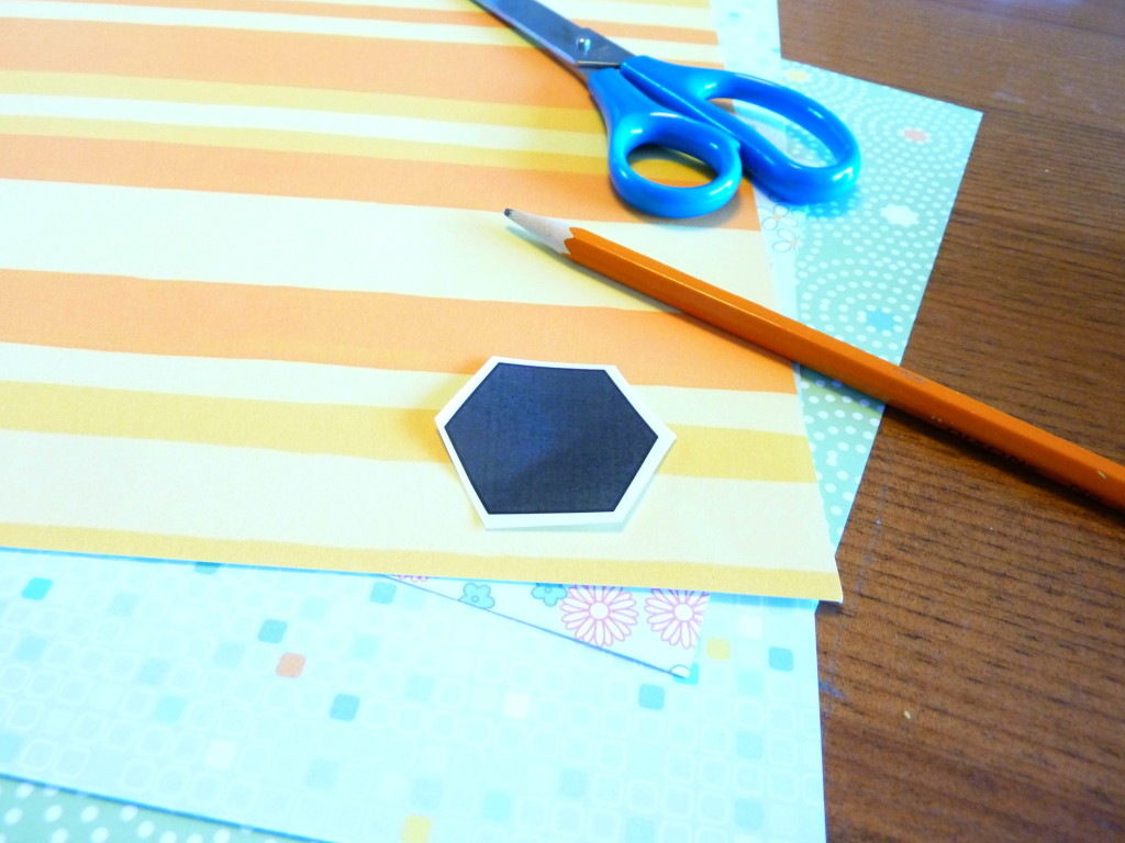 traced hexagon shapes onto scrapbook paper at thehappyhousie