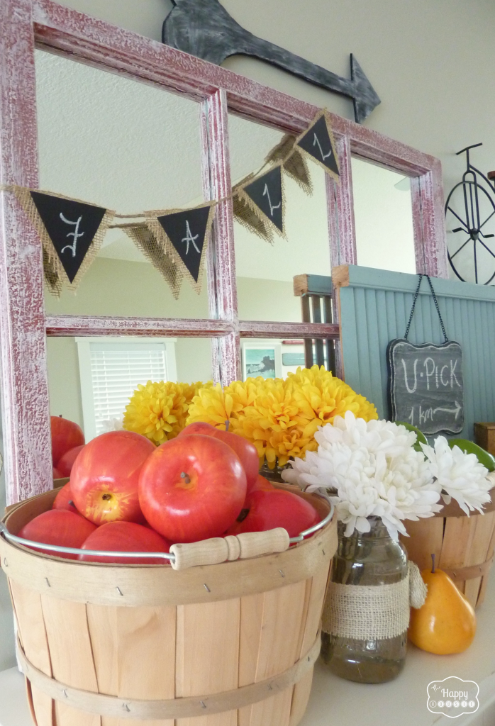 early fall harvest mantel with apples pears mason jar flowers shutters burlap and faux chalkboard bunting at thehappyhousie