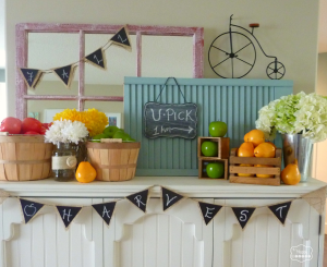 early harvest fall mantel with crates and apples and pears and chalkboard and burlap bunting at thehappyhousie