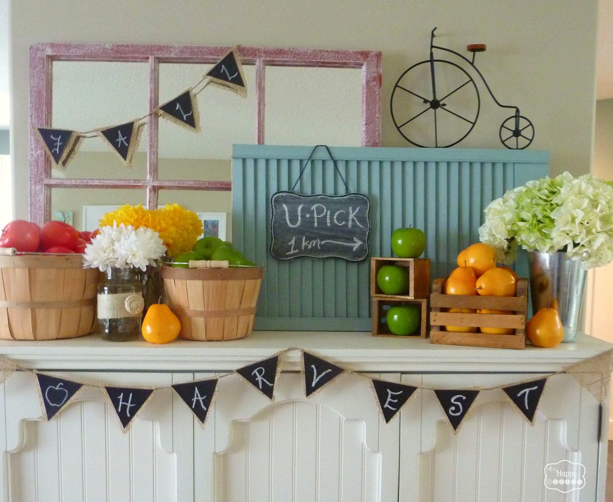 early harvest fall mantel with crates and apples and pears and chalkboard and burlap bunting at thehappyhousie