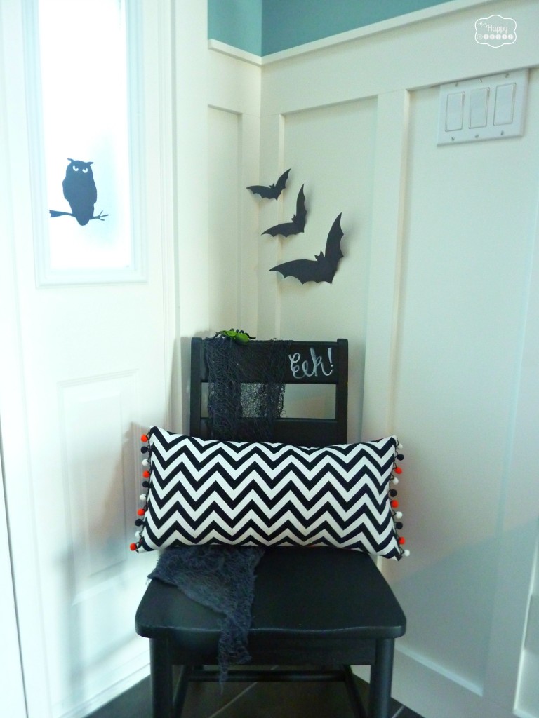 Halloween House Tour with chalkboard chair DIY chevron pillow and bats on the wall at thehappyhousie
