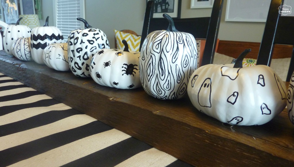 Halloween House Tour with sharpie pumpkins on rustic board centerpiece at thehappyhousie