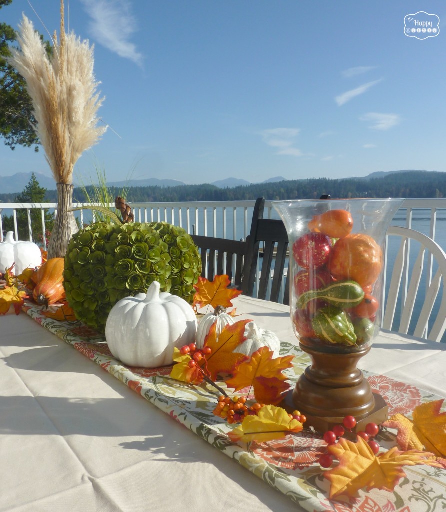 Thanksgiving table outside with fall centerpiece at thehappyhousie