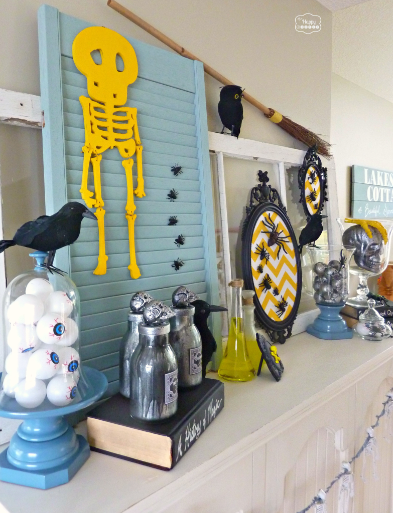 Thrifty Halloween Mantel with DIY Potion Bottles at thehappyhousie