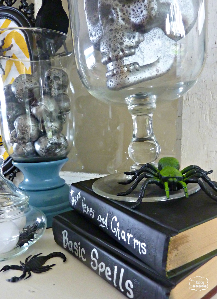 Thrifty Halloween Mantel with DIY glammed up plastic skulls at thehappyhousie