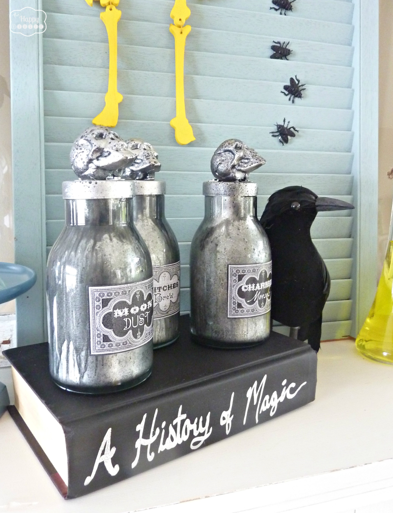 Thrifty Halloween Mantel with DIY spell books and potion bottles at thehappyhousie