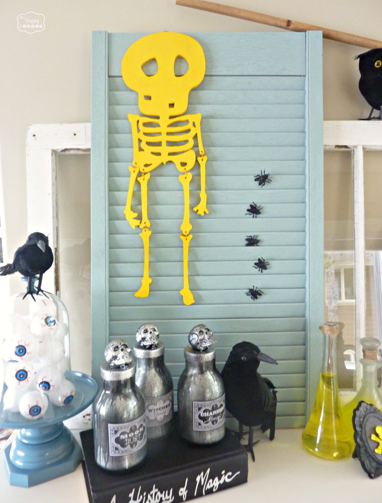 Thrifty Halloween Mantel with diy potion bottles spell books at thehappyhousie