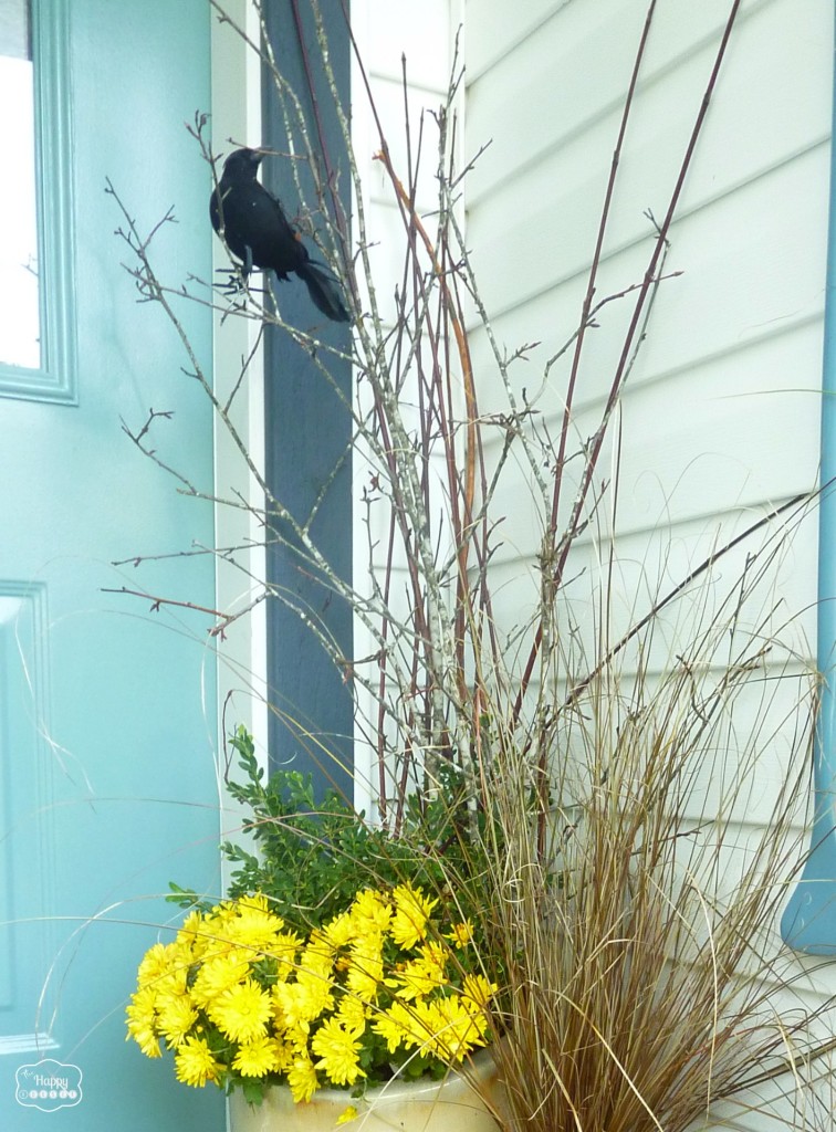 branches and crows in the flower pots for Halloween front porch at thehappyhousie