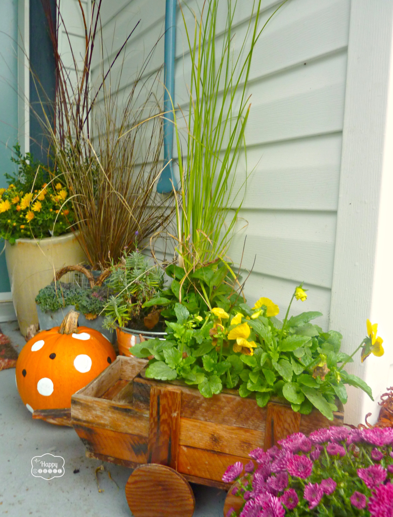 fall front porch with grasses and polka dot pumpkins at thehappyhousie