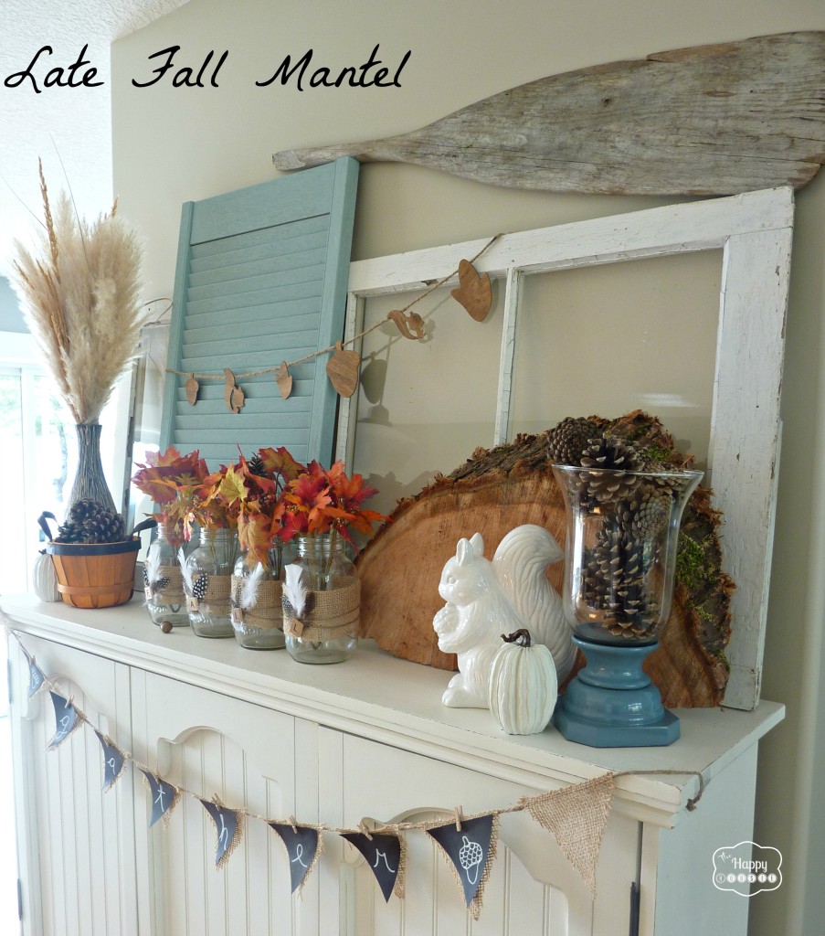 late fall mantel with burlap and feather wrapped mason jars and wood round at thehappyhousie