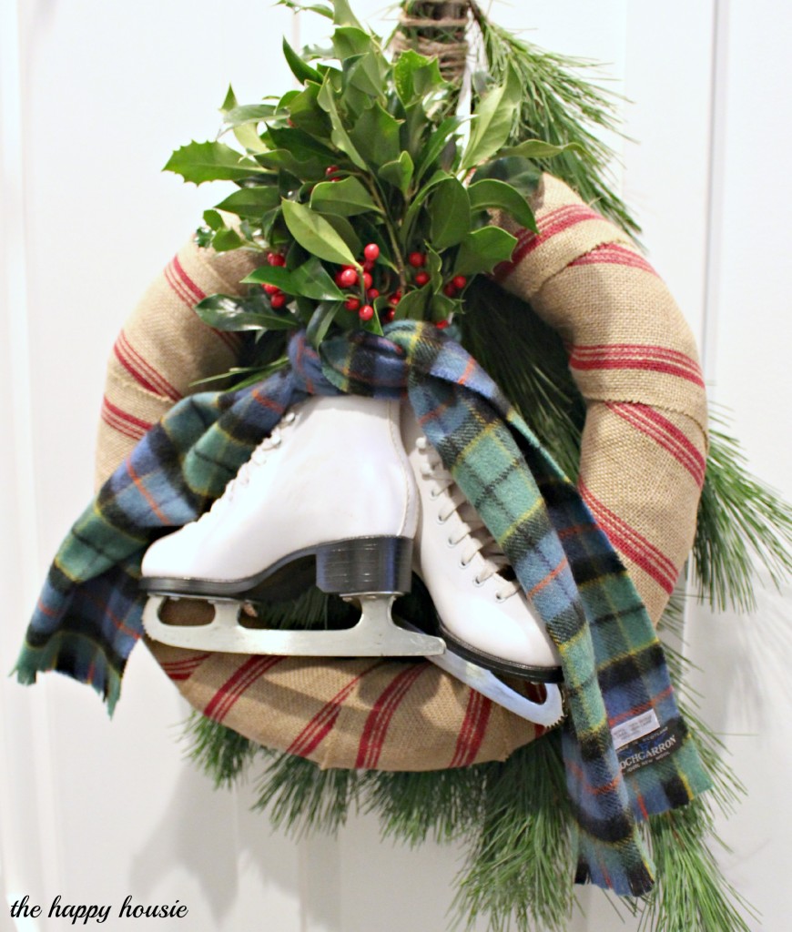 Stripes and Plaid, Boughs and Blades Winter Wreath hanging on the door.