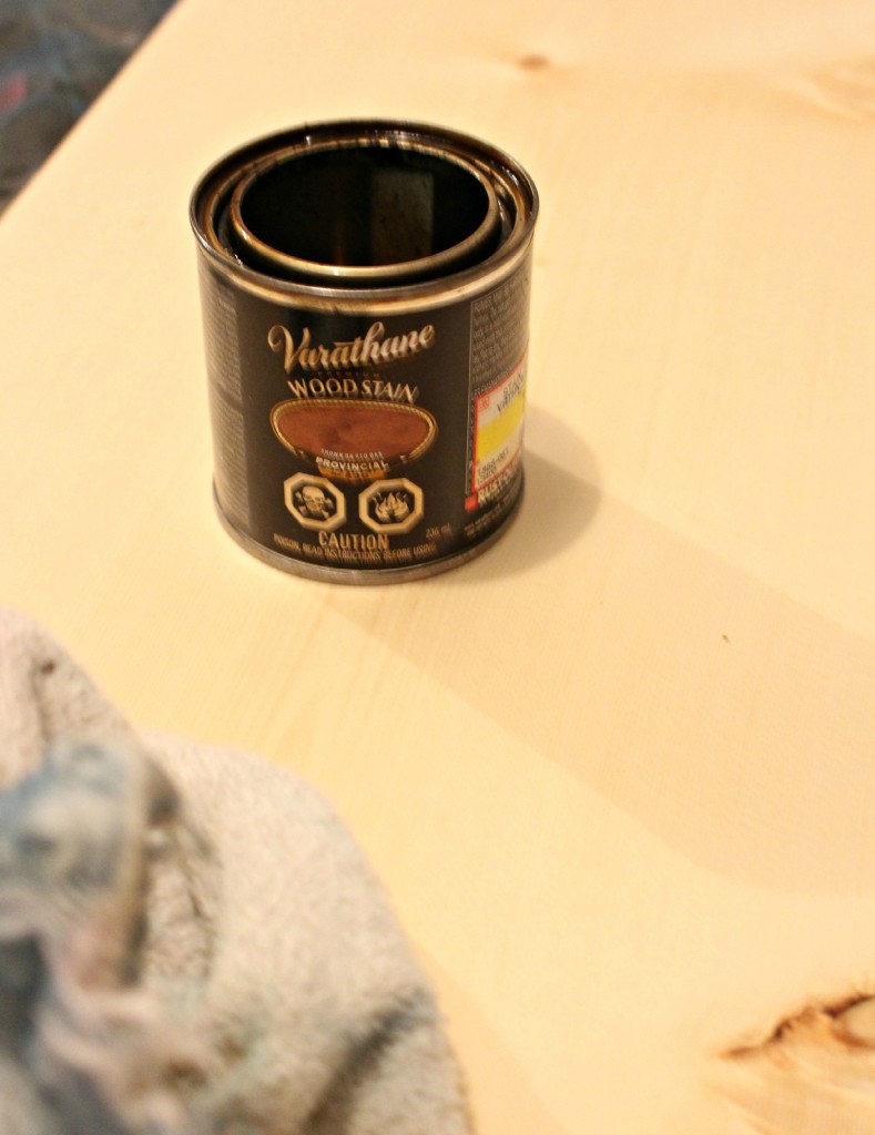 A can of varathane on the wooden board.