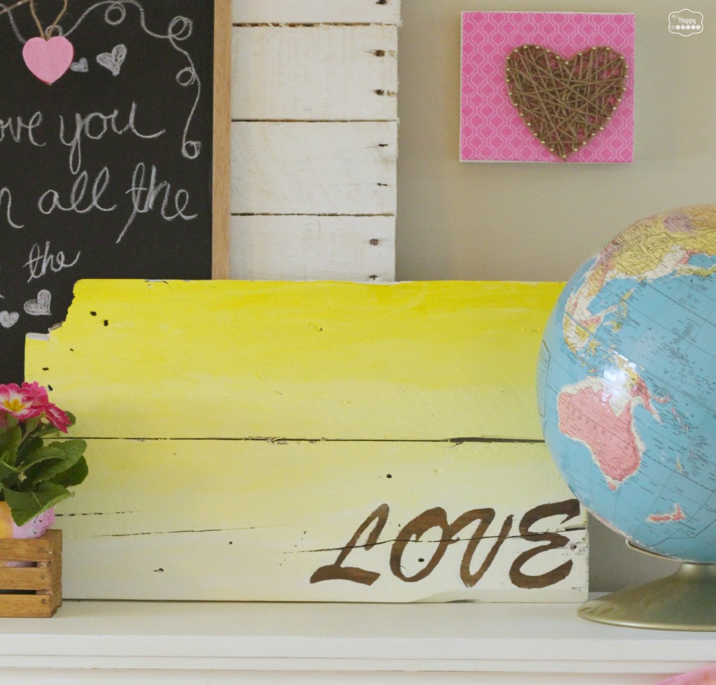 The yellow ombre sign with the word love on it.