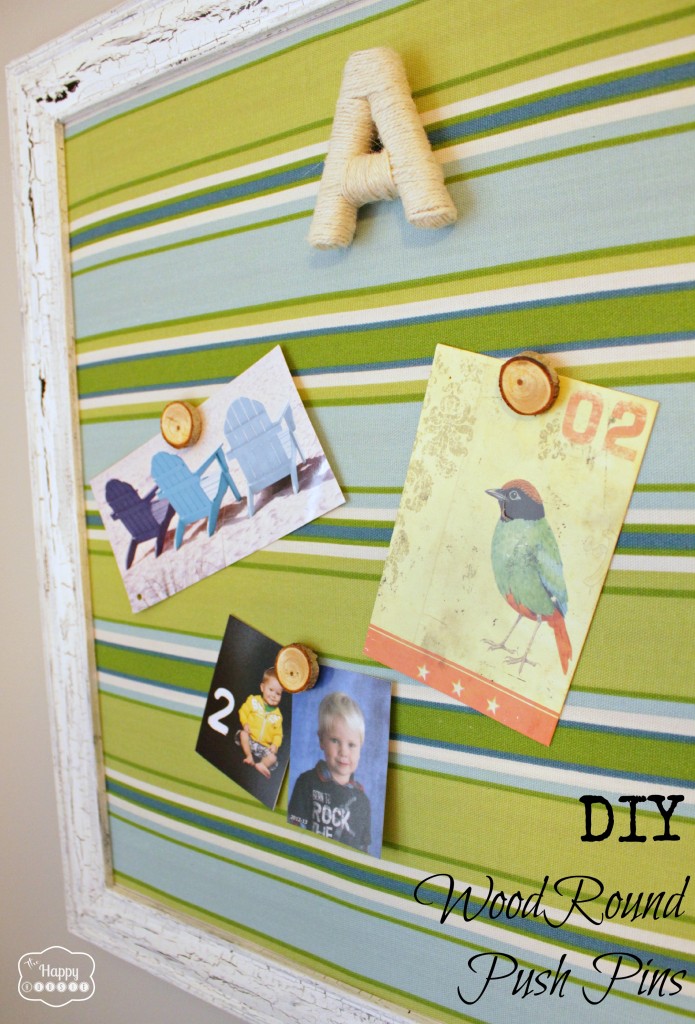DIY Wood Round Push Pins holding up pictures on a cork board.