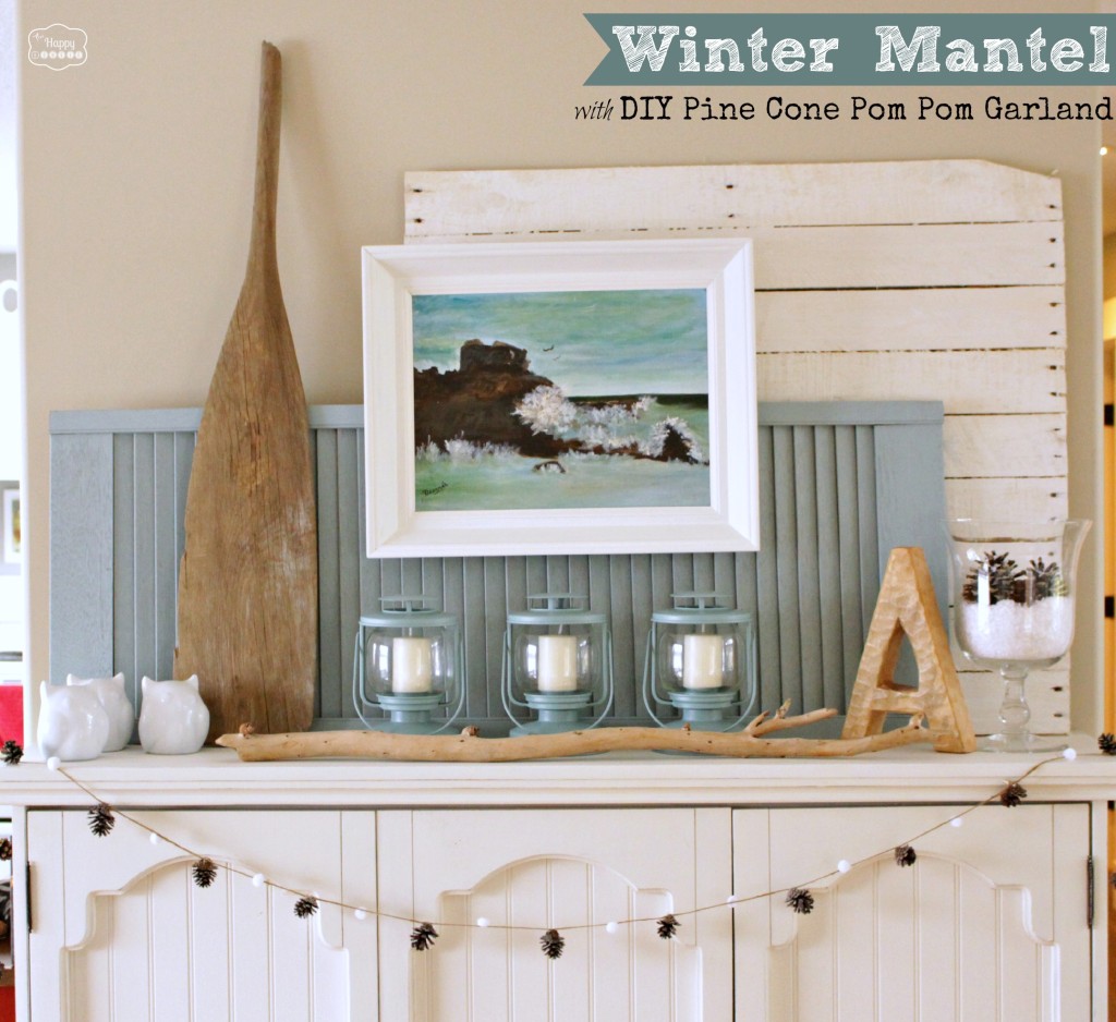 Winter Mantel with DIY Pine Cone Pom Pom Garland by The Happy Housie