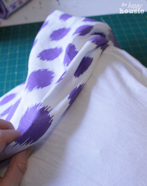 Simple Stunning DIY Envelope Pillow Tutorial stuff the pillow form in at The Happy Housie