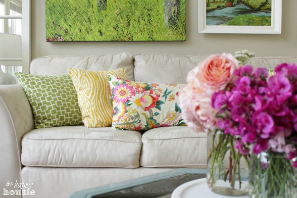 Throw pillows on a neutral couch.