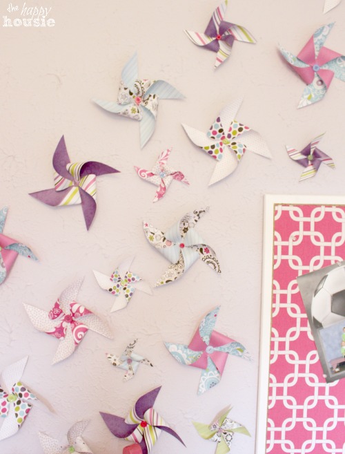 Little Turning Big Girls Bedroom Reveal at The Happy Housie pinwheels on wall