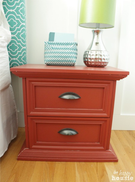 Coral distressed nightstand with gold hardware at The Happy Housie before