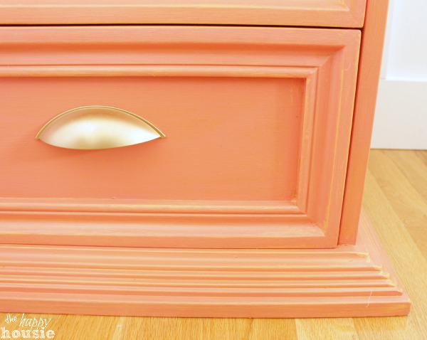 Coral distressed nightstand with gold hardware at The Happy Housie close up