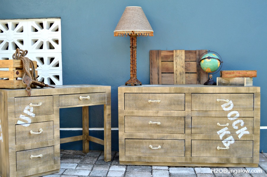 Cargo style dresser in natural wood and white wording.