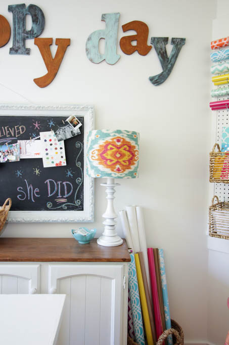I love this colorful organized craft room makeover at thehappyhousie.com-30