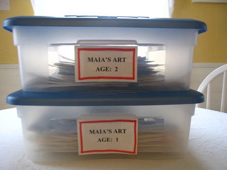 Plastic containers with the school work inside.